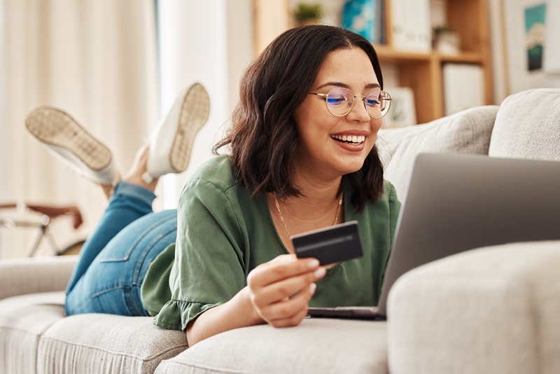 Woman paying with a card online